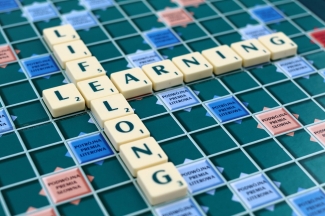 scrabble-tile Scrabble board with the words 'lifelong learning'